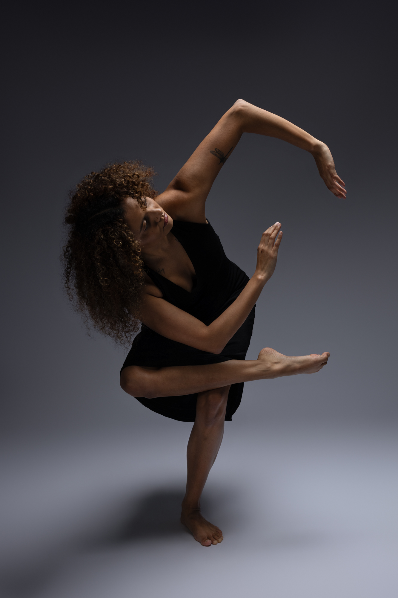 Dancer captured mid-movement in a striking portrait pose